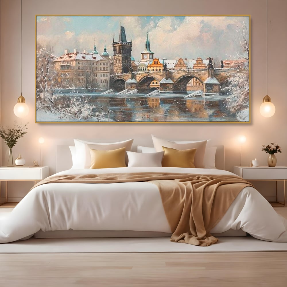 Tablou canvas cu pictura cu podul carol din praga iarna, in rama de aluminiu auriu, pe perete intr-un dormitor